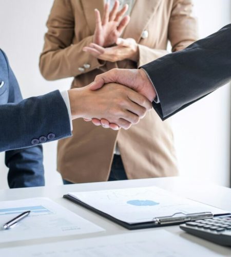 two-confident-business-handshake-and-business-people-after-discussing-good-deal-of-trading-contract-1024x682
